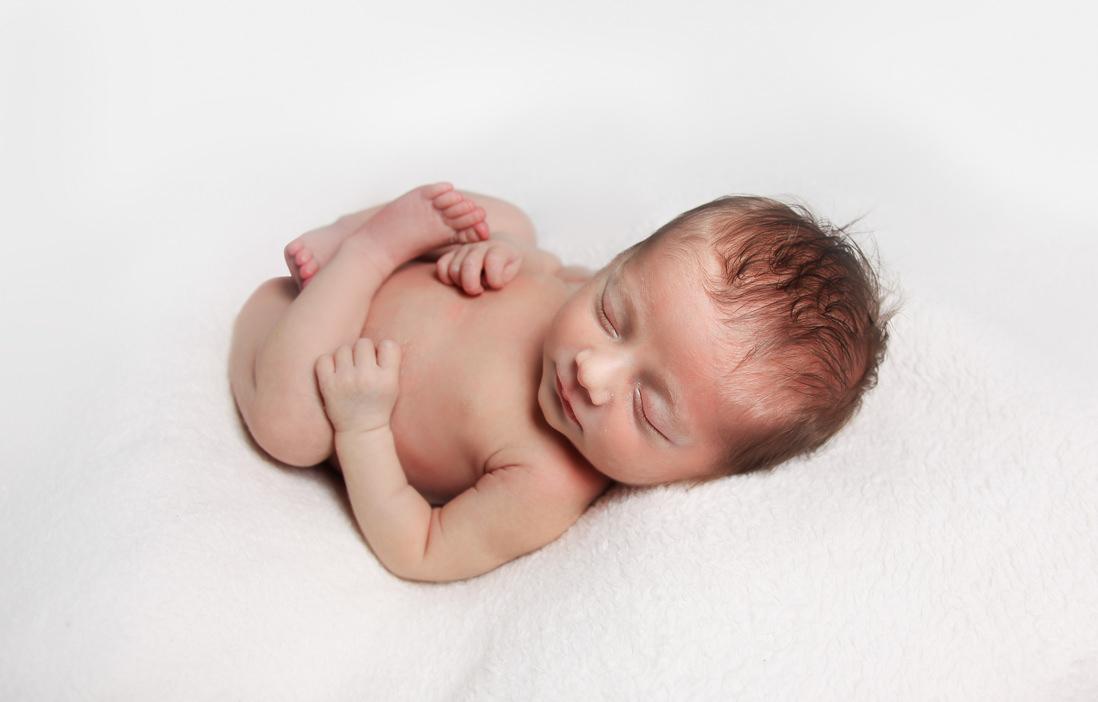image of a newborn baby on a white backdrop