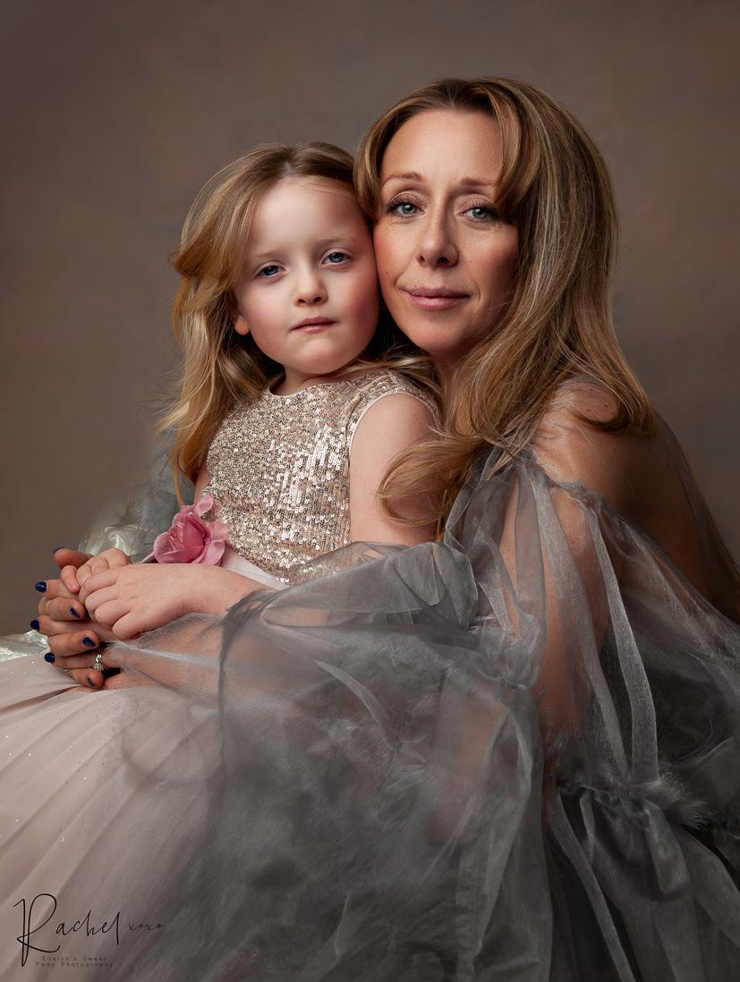 a beautiful mother and her daughter wearing silver dresses